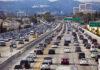 War Premium Torches Pumps Heavy traffic on a multi-lane highway.