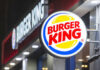 Illuminated Burger King sign at night