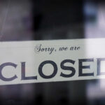 Pet Store Collapse: 75 Closed A sign hanging in a window that reads 'Sorry, we are CLOSED'
