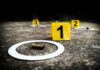 Holiday Bloodbath: Kids Hit, Shooter Vanishes Crime scene with evidence markers and a bullet casing on the ground