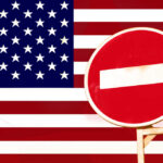 North America’s Backbone Put On Notice A no entry sign in front of the American flag