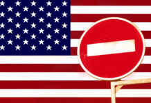 North America’s Backbone Put On Notice A no entry sign in front of the American flag