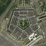 PENTAGON Purge Rattles Military Press Aerial view of the Pentagon building surrounded by roads and parking lots