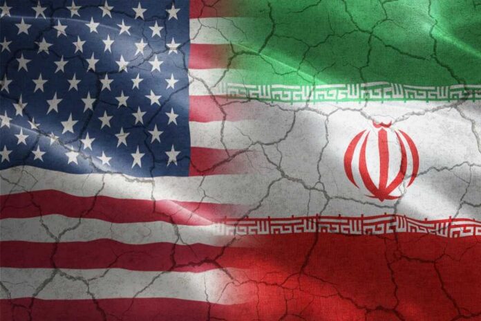 shutterstock_1607433346 Flags of the United States and Iran blended together with a cracked texture