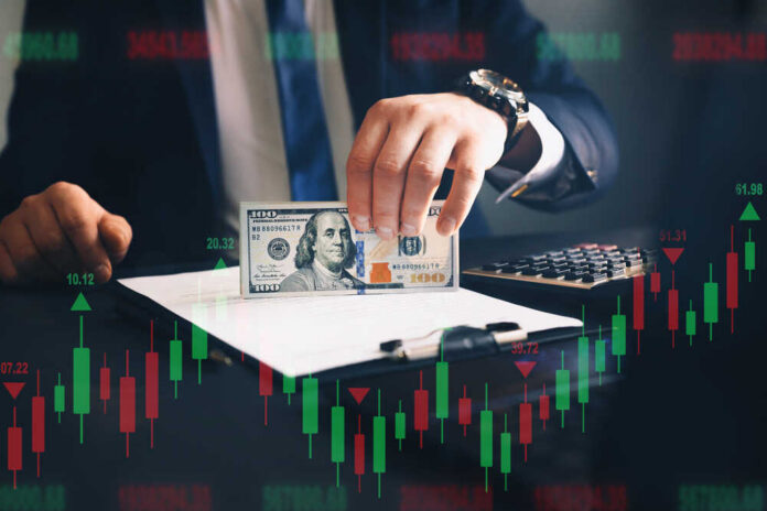 Businessman,Holding,Bunch,Of,Dollars.,Financial,Investment,Concept.,Forex,Trading