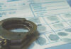 Handcuffs on a fingerprint document.