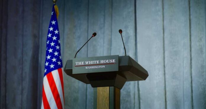 Speech,Tribune,For,Government,Representative,Of,The,United,States,Or Press podium with the White House sign and an American flag in the background