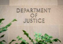 DOJ Backtrack Stuns Lincoln Memorial Case Department of Justice building wall with engraved lettering