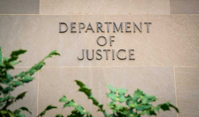 The,United,States,Department,Of,Justice,(doj),In,Washington,D.c., Department of Justice building wall with engraved lettering