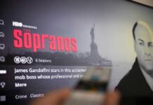 Sopranos Shock: Bronx Discovery Stuns Fans Screen displaying the HBO series The Sopranos with a remote in the foreground
