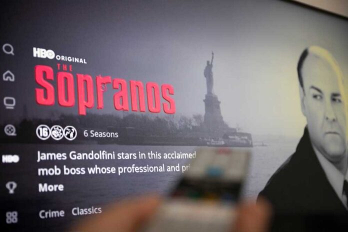 Screen displaying the HBO series The Sopranos with a remote in the foreground