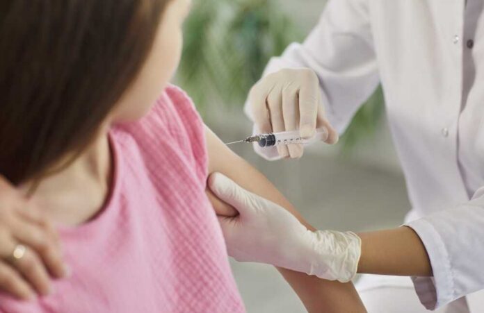 Child,Receives,Vaccination,Injection,From,Doctor.,A,Nurse,Uses,A