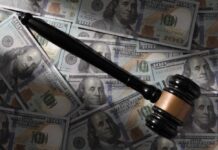 Court SMACKS Down Trump’s Climate Cash Grab Judge’s gavel on scattered US hundred-dollar bills