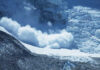 Melting Glacier Spits Out Long-Lost Climbers An avalanche cascading down a glacier in a mountainous region
