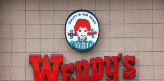 Wendy's restaurant sign on exterior wall