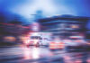 Ambulance speeding through city street at night