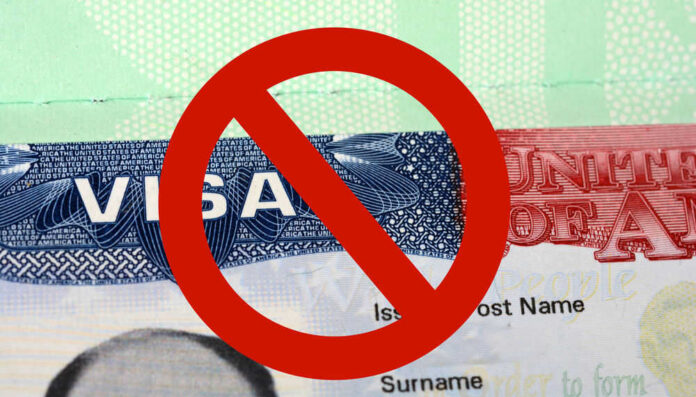 US visa with prohibition symbol overlay