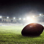VIDEO: Touchdown, Then Deadly Silence Football on field in illuminated stadium at night.