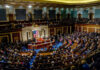 Congress Flirts With AI Freeze? Full chamber meeting with numerous attendees and speakers.