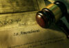 Gavel and Constitution with 1st Amendment text.