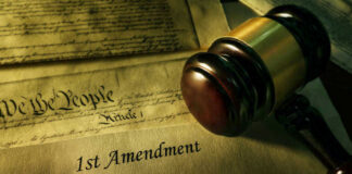 Gavel and Constitution with 1st Amendment text.