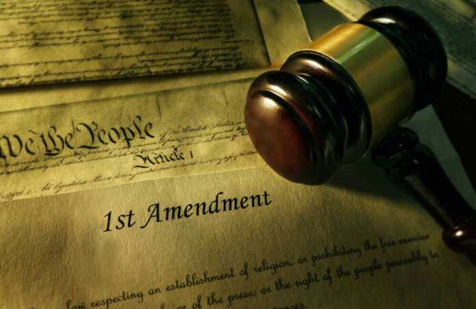 shutterstock_1187197336 Gavel and Constitution with 1st Amendment text.