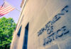DOJ Targets Grocery Giants Because of THIS?! Department of Justice building with American flag.