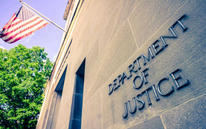 shutterstock_1384089728 Department of Justice building with American flag.
