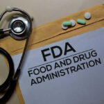 Spicy Scare Hits Chipotle Stethoscope and medication on a folder labeled FDA
