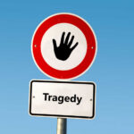 TRAGEDY: Hunter’s Shot Kills Mom In Field Road sign with hand stop symbol and a lower sign reading Tragedy