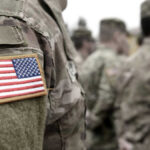 NEW VIDEO: Shot-Down U.S. Colonel Survives 50 Hours in Iran Soldiers in camouflage uniforms with American flag patches.