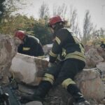 MIRACLE: Eight Days Buried — He Walked Out Alive Firefighters search through rubble after a building collapse