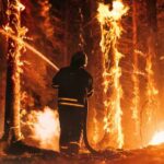 Firestorm Trap: Three Heroes Die (VIDEO) Firefighter battling a raging forest wildfire at night