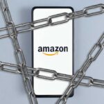 Amazon Grounds Partner After Deadly Incident Smartphone with e-commerce logo wrapped in metal chains