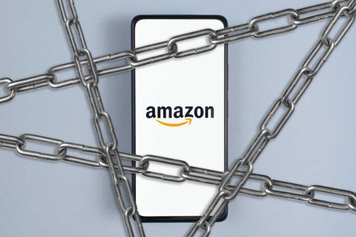 Amazon,And,Sanctions,,Arrest,,Crisis,,Blocking,Concept.,Amazon,Company,Logo Smartphone with e-commerce logo wrapped in metal chains