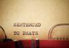 TV Star Condemned — Death by Hanging Typewriter typing the phrase 'Sentenced to Death' on aged paper
