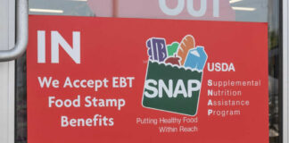 Red sign accepting EBT food stamp benefits SNAP