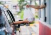 PROOF: Lib City’s Forced Pay Hike Backfires Drive-thru window handing a takeout bag to a car
