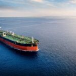 Tanker Chaos Ignites Deadly Standoff An oil tanker navigating through calm ocean waters