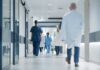 Medical staff walking through a hospital corridor