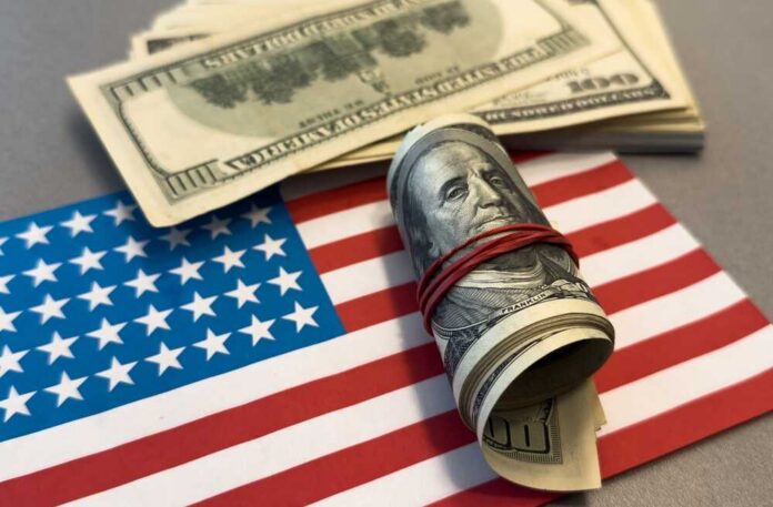 American,Money.,World,Economic,Crisis.,Currency,Exchange.,Fed.,100,Dollars A roll of hundred dollar bills placed on an American flag