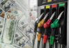 Freight Costs Explode As Diesel Spikes Fuel pump nozzles next to spread of U.S. hundred-dollar bills