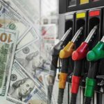 Freight Costs Explode As Diesel Spikes Fuel pump nozzles next to spread of U.S. hundred-dollar bills