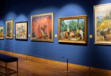 Dawn Heist Jolts Famed Art Museum Art gallery showcasing various colorful paintings on a blue wall