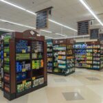 Ice Cream Lawsuit Triggers SHOCK Bankruptcy Interior view of a grocery store aisle with shelves of food and beverages