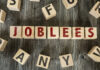 4,000 Jobs Vanishing From Famed Carmaker Wooden letter blocks arranged to spell a word on a rustic table