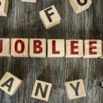 4,000 Jobs Vanishing From Famed Carmaker Wooden letter blocks arranged to spell a word on a rustic table