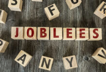 4,000 Jobs Vanishing From Famed Carmaker Wooden letter blocks arranged to spell a word on a rustic table
