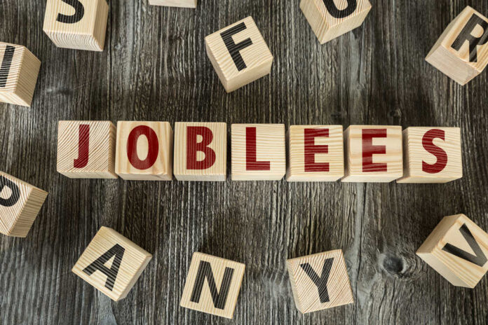 Wooden letter blocks arranged to spell a word on a rustic table