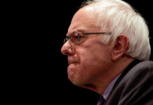 Bernie’s Cash Blitz Stuns Pols Bernie Sanders in glasses.